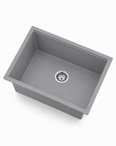 Gray single bowl quartz composite kitchen sink with stainless drain, angled product view