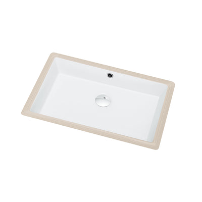Shallow rectangular ceramic undermount sink in white with rounded interior corners and a chrome drain