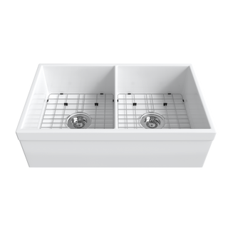 White apron-front double-bowl fireclay farmhouse sink with two stainless bottom grids and strainers — SANIKB SNT3320HD