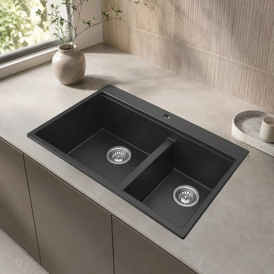 Black double bowl quartz composite kitchen sink installed in a styled kitchen — lifestyle scene, SANIKB SN8456.