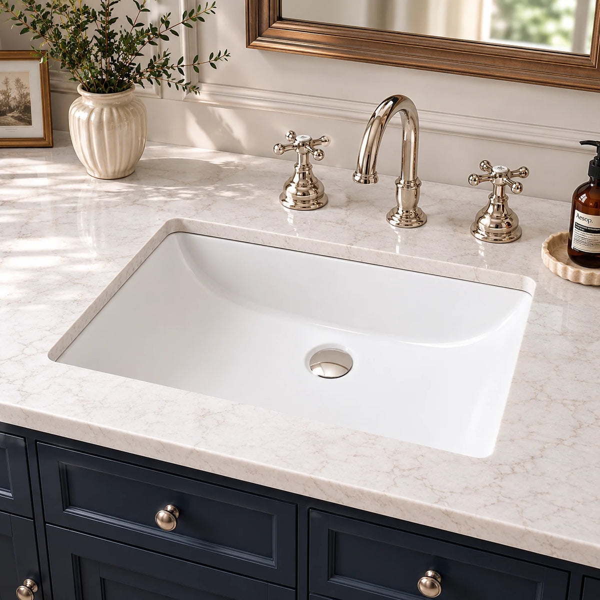 Ceramic undermount bathroom sink installed in a styled bathroom — lifestyle scene, SANIKB SN018.