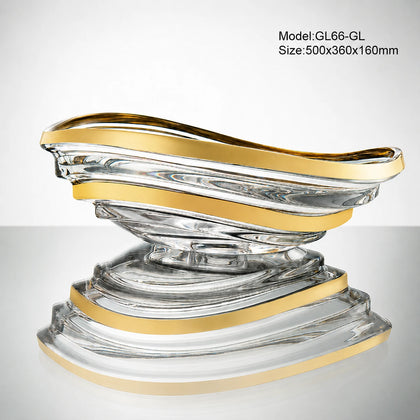 Clear conch glass vessel sink with gold-trimmed rim, sculptural seashell bathroom basin