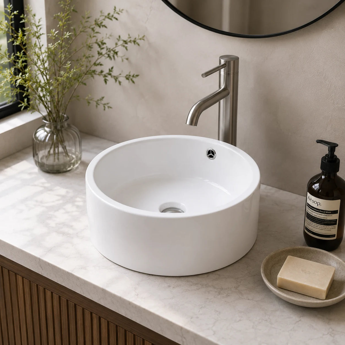 Deep round ceramic vessel sink installed in a styled bathroom — lifestyle scene, SANIKB SN134-537.