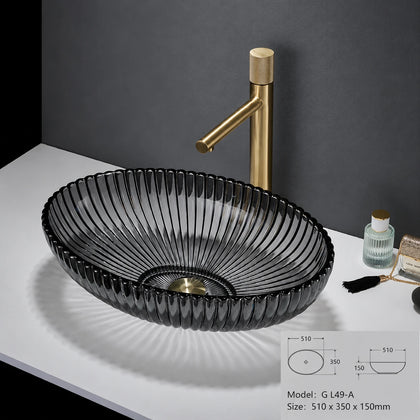 Smoke grey fluted oval glass vessel sink with gold faucet, 510mm ingot bowl