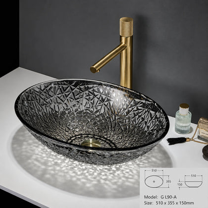 Smoke grey faceted glass vessel sink with gold faucet, oval 510mm bowl