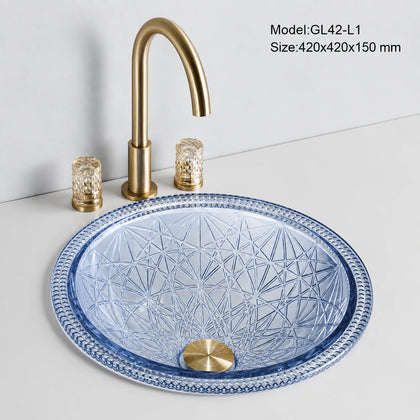 Clear glass vessel sink with blue rim and gold faucet, round 420mm starburst-cut bowl
