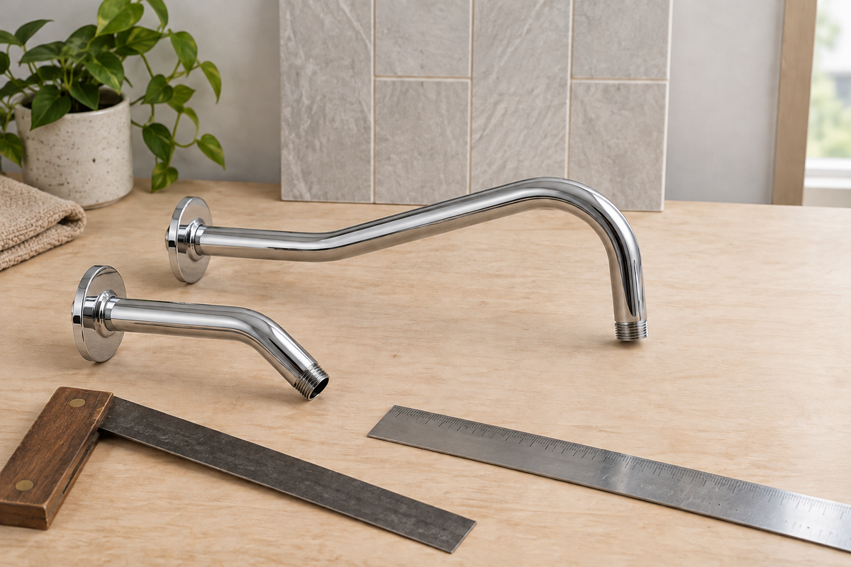 Detached short and extended shower arms with measuring tools, illustrating projection planning.