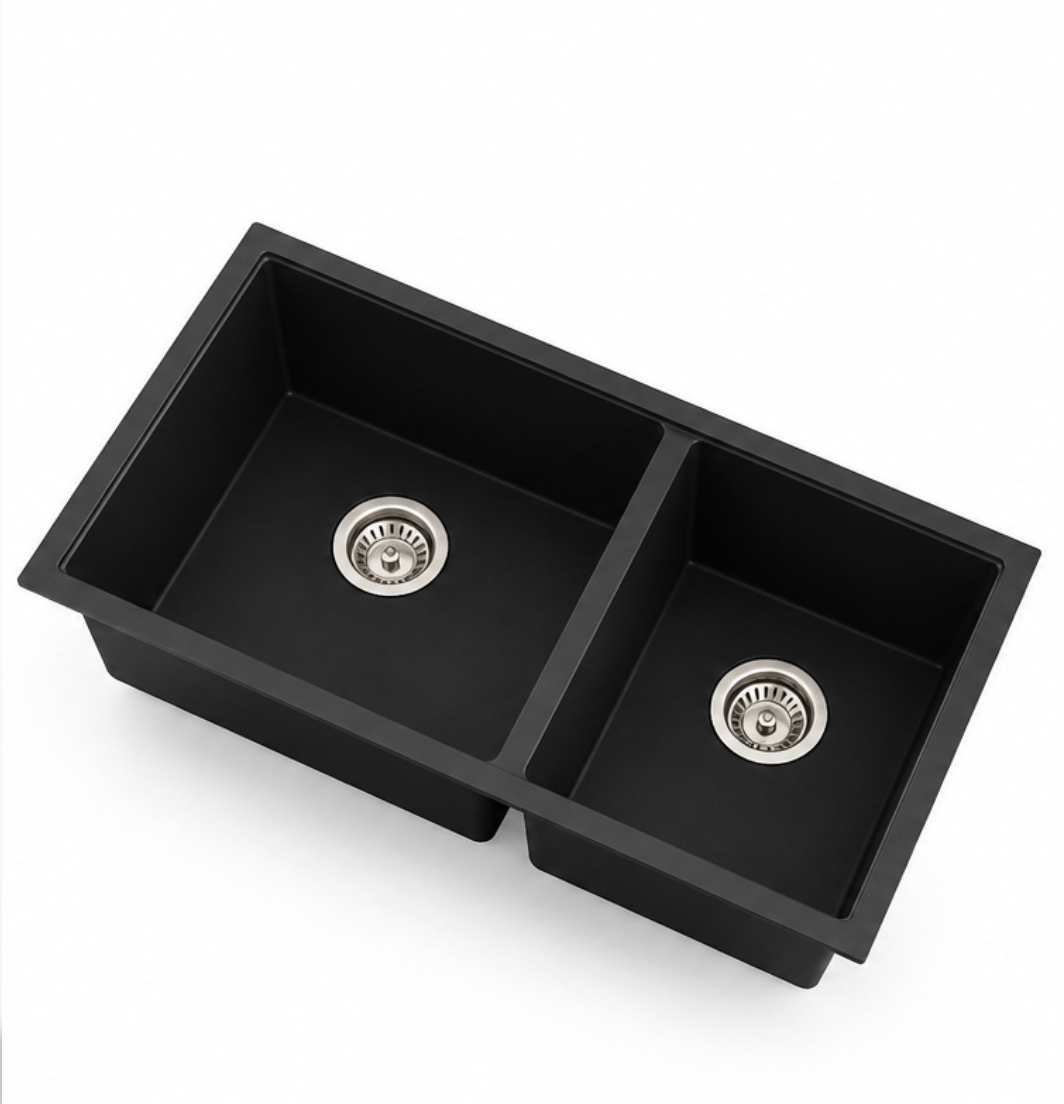 Black double bowl quartz composite kitchen sink option with divided rectangular basins and drain fittings