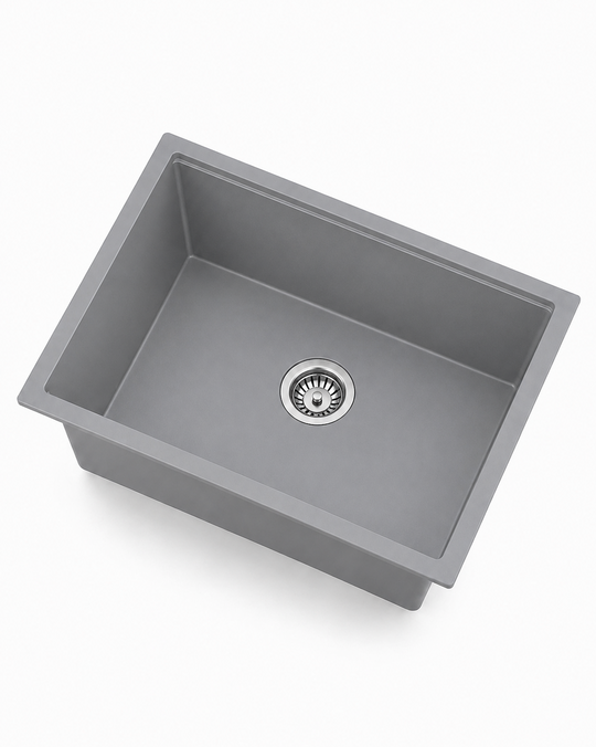 Gray single bowl quartz composite kitchen sink with stainless drain, angled product view