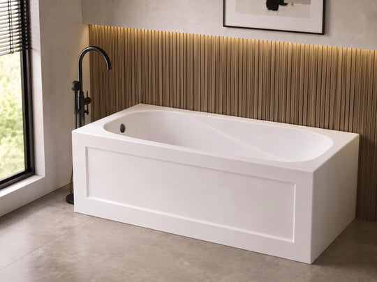 BTS6032R 60x32 skirted apron acrylic bathtub installed in a modern bathroom with a black freestanding faucet and wood-slat accent wall