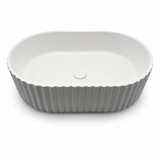 Ribbed concrete utility sink C0004 with rounded rectangular basin and vertical fluted exterior for laundry and utility projects