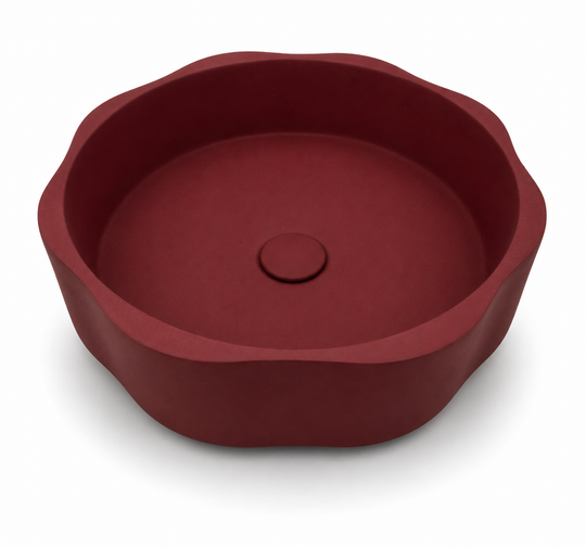Decorative round concrete basin C0041 in KR deep red finish with sculptural scalloped rim for countertop vanity projects