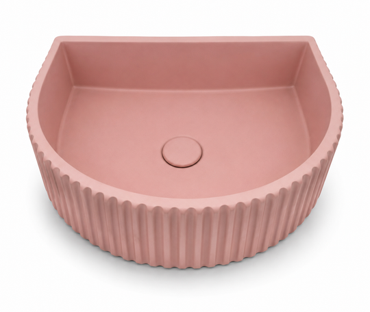 C1001 soft pink fluted half-moon concrete floating sink with ribbed exterior and smooth interior bowl