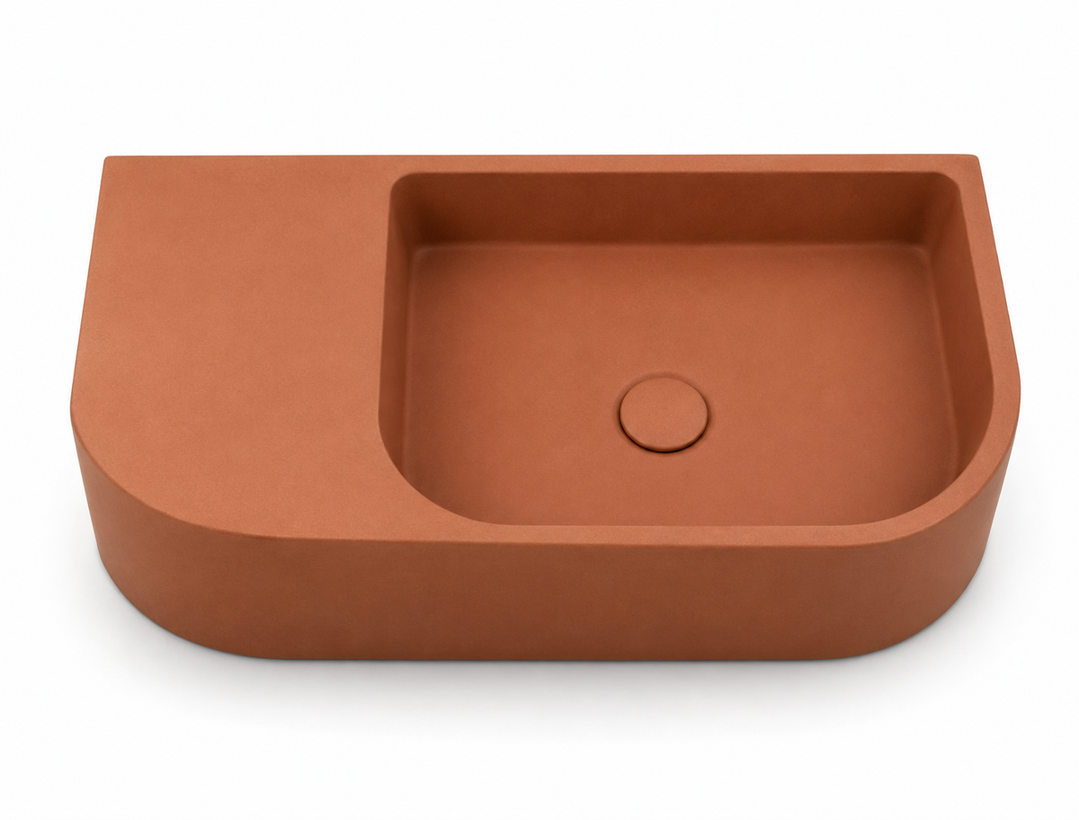 C1002 KO concrete floating vanity sink with offset basin, rounded corners, and integrated side deck