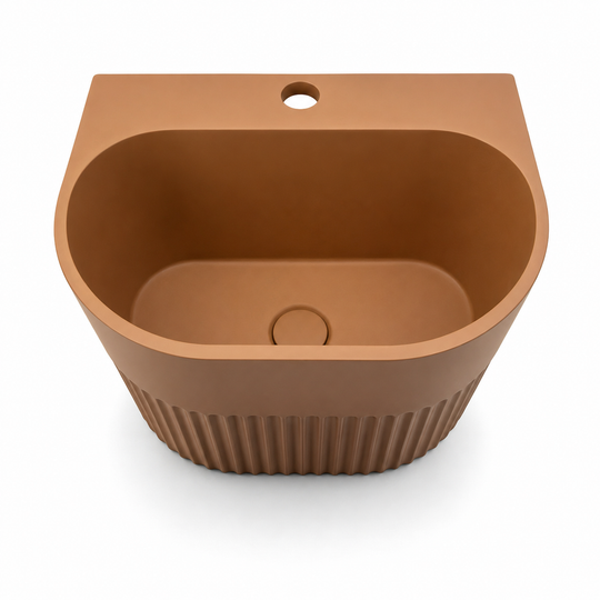 C1005 KO color concrete mop sink with deep rounded-front basin, faucet hole, center drain, and ribbed lower exterior for utility and janitorial spaces