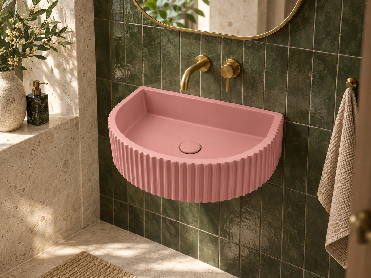 C1001 pink fluted half-moon concrete sink in a boutique hotel powder room