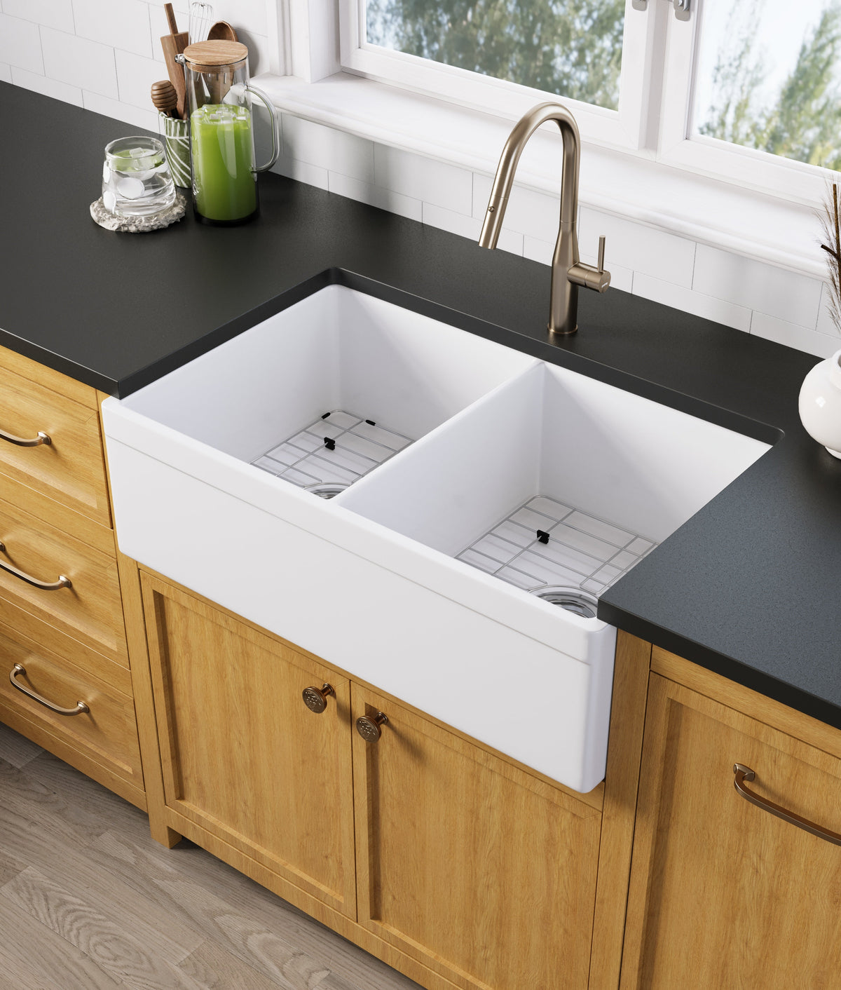 White double-bowl fireclay apron-front farmhouse sink installed in a kitchen — SANIKB SNT3320HD
