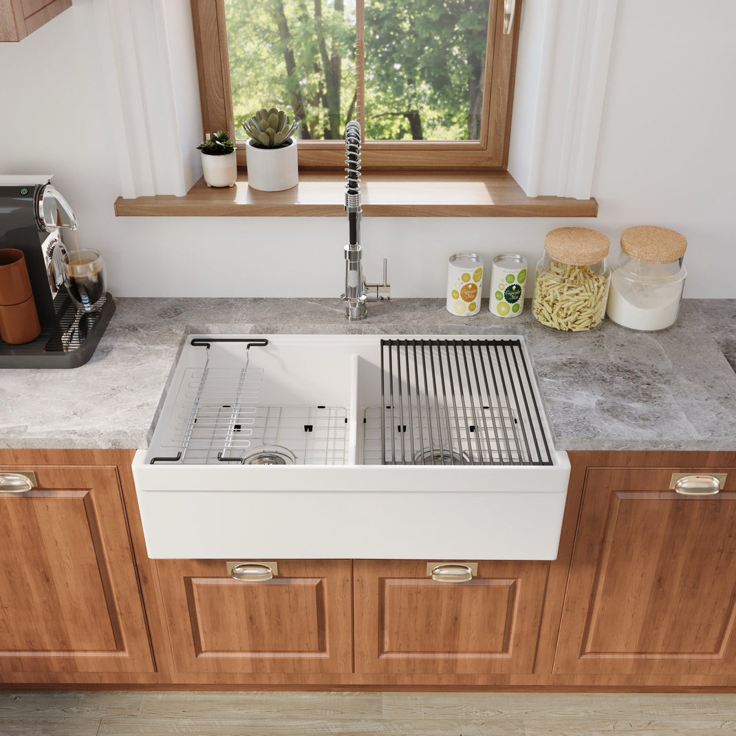White double-bowl smooth-apron fireclay farmhouse sink installed in a kitchen — SANIKB SN3320WD