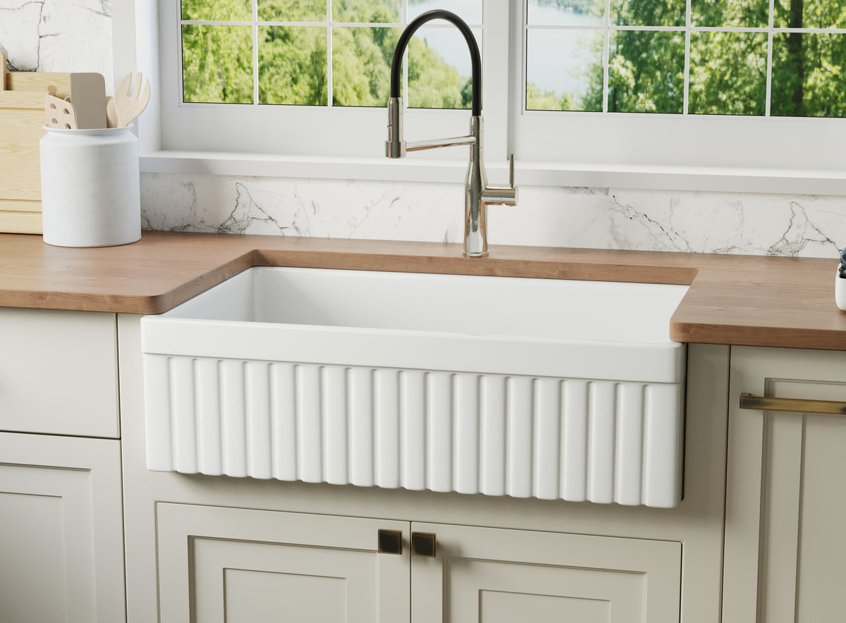 33-inch fluted-apron fireclay farmhouse sink installed in a modern kitchen — SANIKB SN3320T