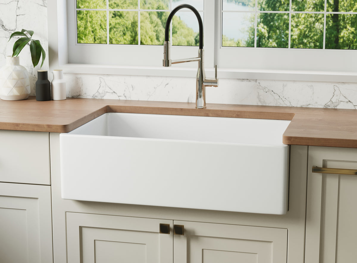 Reversible apron fireclay farmhouse sink shown with the smooth flat front facing out — SANIKB SN3320T