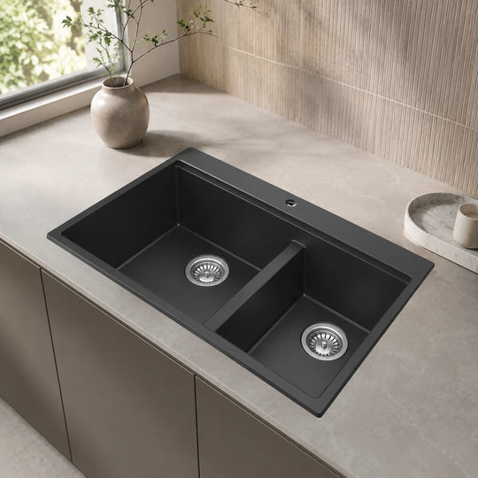 Black double bowl quartz composite kitchen sink installed in a styled kitchen — lifestyle scene, SANIKB SN8456.