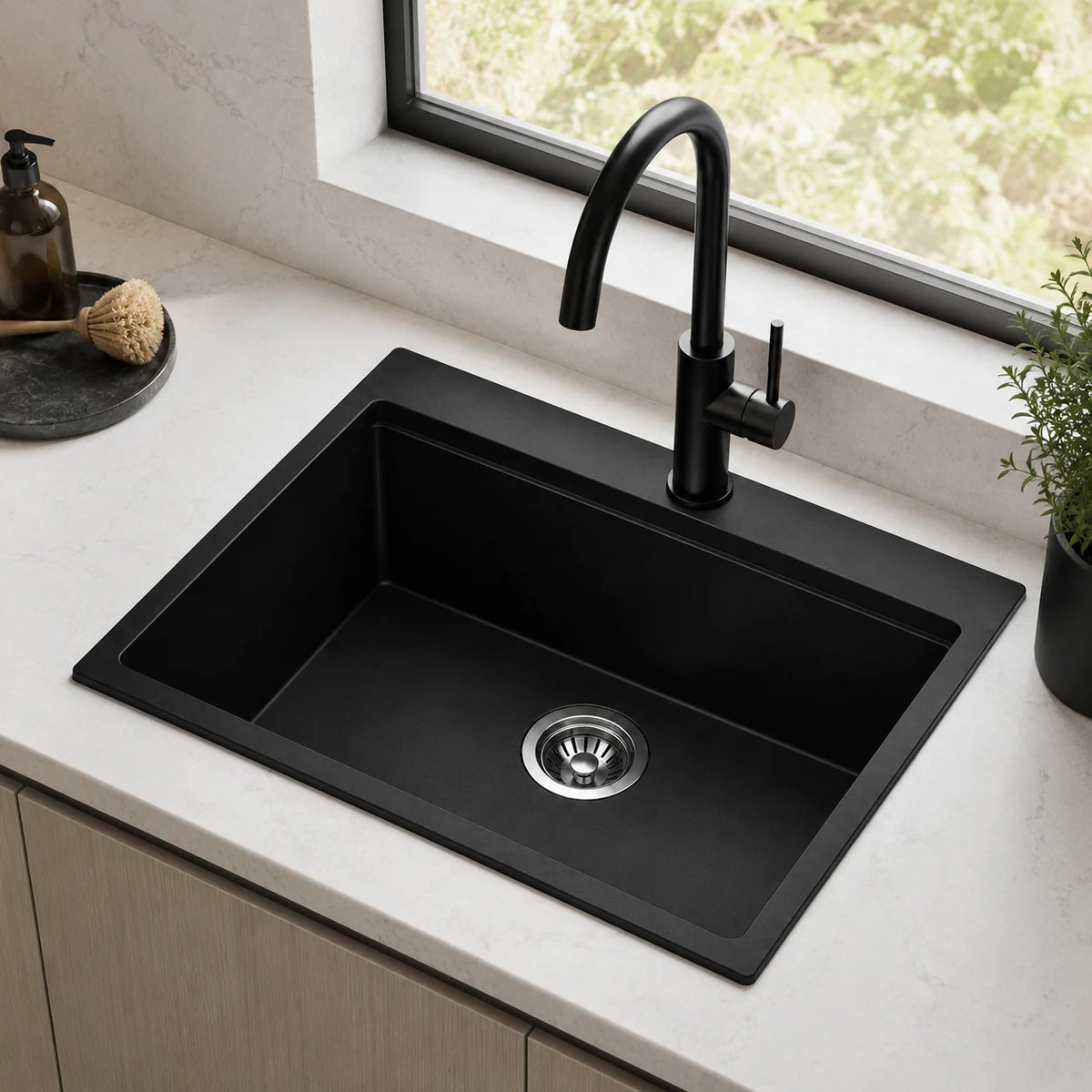 Black drop in quartz composite sink installed in a styled kitchen — lifestyle scene, SANIKB SN5855.