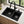 Black offset double bowl quartz composite sink installed in a styled kitchen — lifestyle scene, SANIKB SN7850.