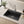 Black quartz composite kitchen sink with drainboard installed in a styled kitchen — lifestyle scene, SANIKB SN8549B.