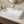 Ceramic trough vessel sink installed in a styled bathroom — lifestyle scene, SANIKB SN165.