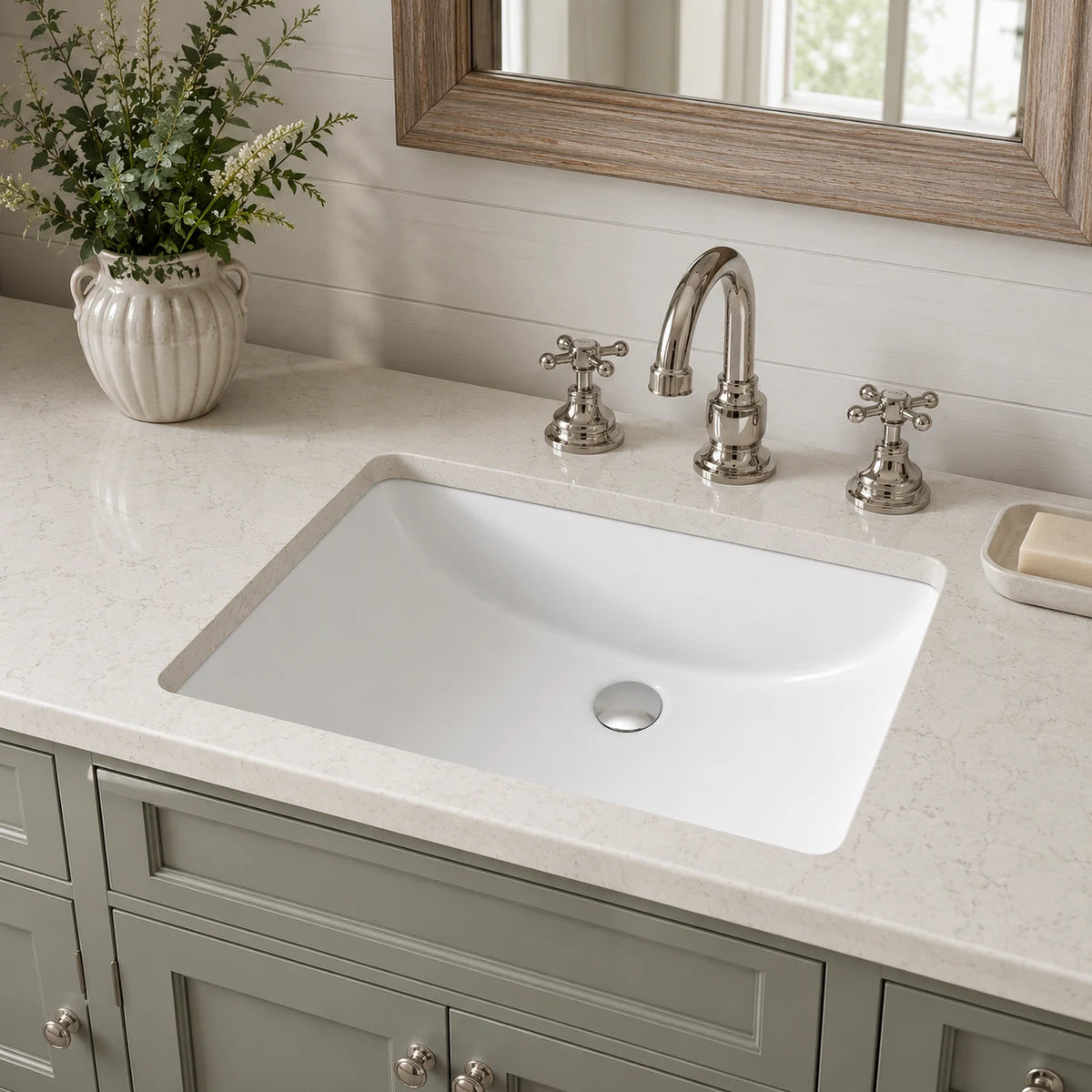 Ceramic undermount bathroom sink installed in a styled bathroom — lifestyle scene, SANIKB SN017.