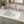 Ceramic undermount bathroom sink installed in a styled bathroom — lifestyle scene, SANIKB SN017.