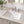 Ceramic undermount bathroom sink installed in a styled bathroom — lifestyle scene, SANIKB SN026.