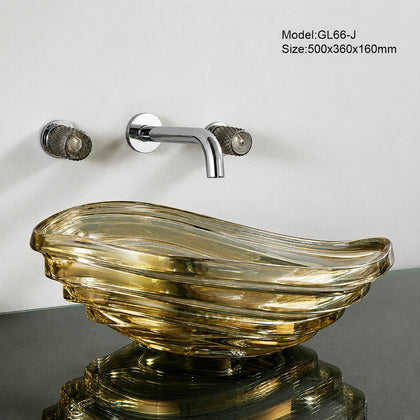 Golden amber clear conch glass vessel sink with chrome wall faucet, seashell basin