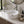 537c cylindrical round ceramic vessel sink installed in a styled bathroom — lifestyle scene, SANIKB SN134-537C.