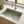Green single bowl quartz composite sink installed in a styled kitchen — lifestyle scene, SANIKB SN7842.