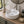 Oval ceramic vessel sink with faucet deck installed in a styled bathroom — lifestyle scene, SANIKB SN140-1101.