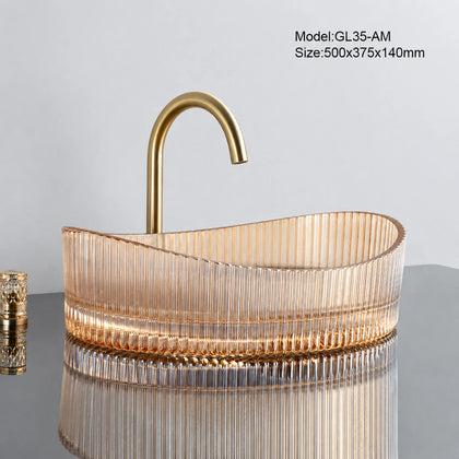 Amber fluted oval glass vessel sink with gold faucet, 500mm above-counter bathroom basin