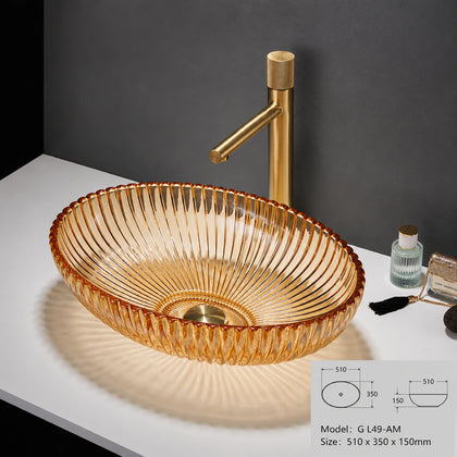 Amber ribbed oval glass vessel sink with brushed gold faucet, 510mm bathroom bowl