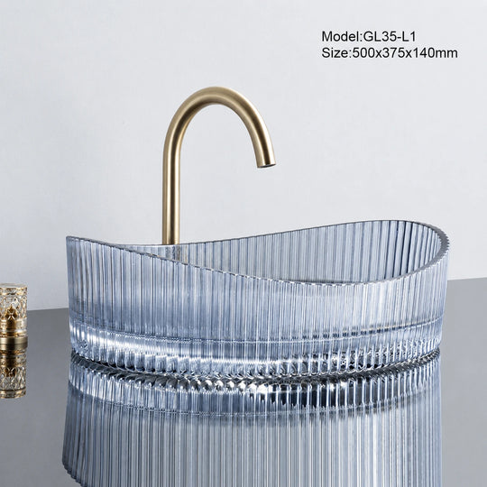 Blue tinted fluted oval glass vessel sink with gold faucet, 500mm above-counter basin