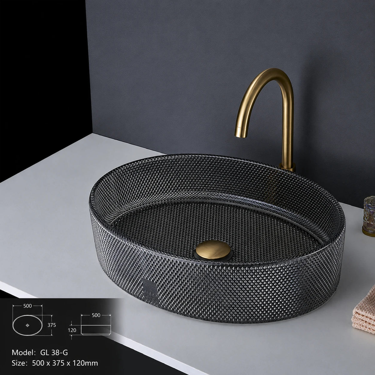 Charcoal grey faceted glass vessel sink with gold faucet, oval 500mm bowl