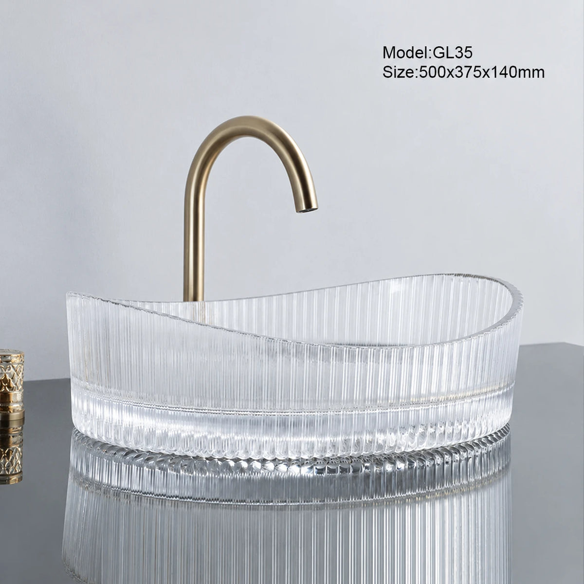 Clear fluted oval glass vessel sink with gold faucet, 500mm above-counter bathroom basin
