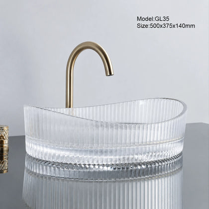Clear fluted oval glass vessel sink with gold faucet, 500mm above-counter bathroom basin
