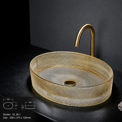 Clear gold-rimmed faceted glass vessel sink with gold faucet, oval 500mm bowl