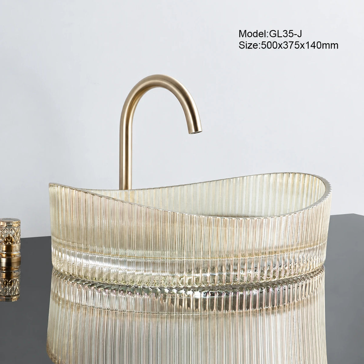 Clear gold-tinted fluted oval glass vessel sink with gold faucet, 500mm bathroom basin