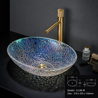 Iridescent rainbow faceted glass vessel sink with gold faucet, oval bowl