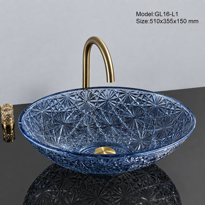 Sapphire blue faceted glass vessel sink with gold faucet, oval 510mm starburst-cut bowl