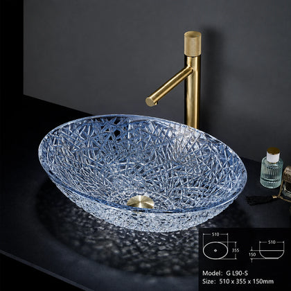 Sapphire blue faceted glass vessel sink with gold faucet, oval 510mm bowl