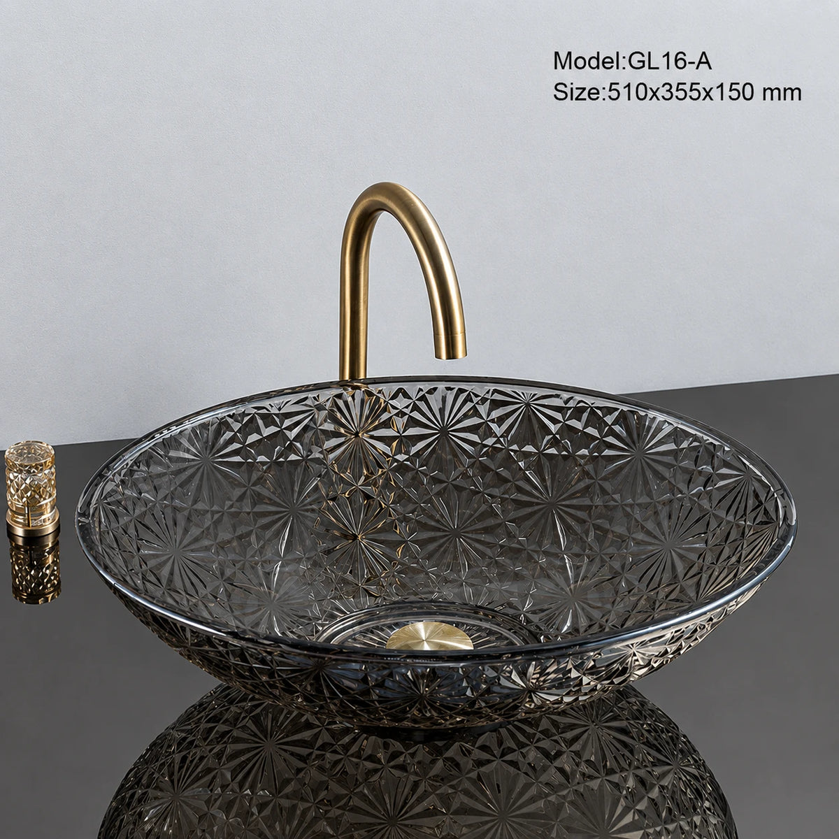Smoke grey faceted glass vessel sink with gold faucet, oval 510mm starburst-cut bowl