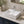 Recessed rectangular ceramic countertop basin installed in a styled bathroom — lifestyle scene, SANIKB SN107-016.