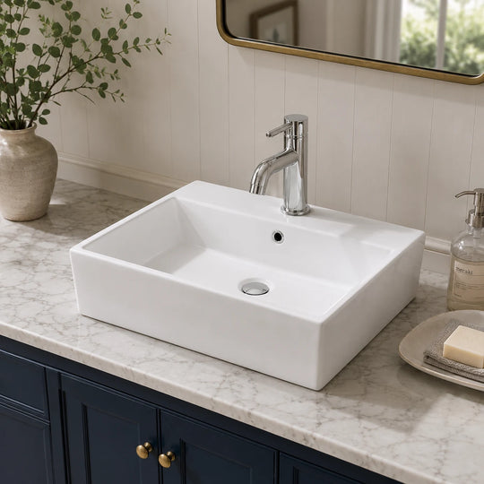 Recessed rectangular ceramic countertop basin installed in a styled bathroom — lifestyle scene, SANIKB SN107-016.